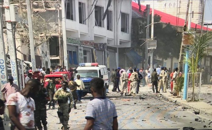 Police officers are seen at the scene of blast at Sayidka Junction following a car bomb on Saturday June 15, 2019. Photo credit/ Said Yusuf Warsame.