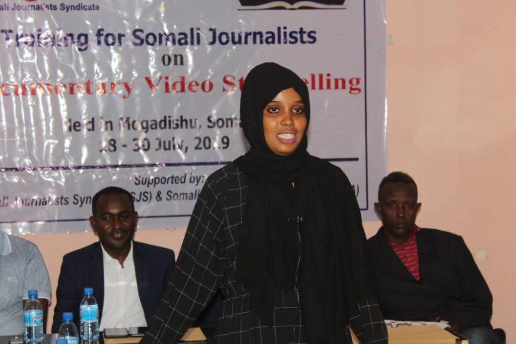  Asma Yasin Osman, a camerawoman and producer at Som News TV speaks during the closing session of a two-week course on Documentary Video Storytelling in Mogadishu Thursday 8 July, 2019.