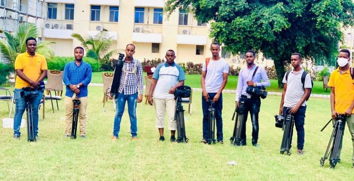 Journalists covering Covid-19 pandemic pose for a photo in Mogadishu