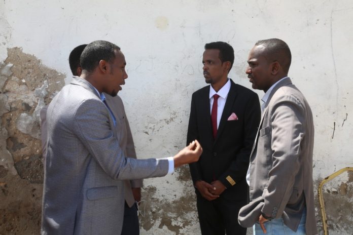 SJS secretary general, Abdalle Mumin (right), SOMA secretary general, Mohamed Abduwahab (right) and Goobjoog journalist Abdiaziz Ahmed Gurbiye shortly after the court hearing ends on Tuesday 14 July, 2020.