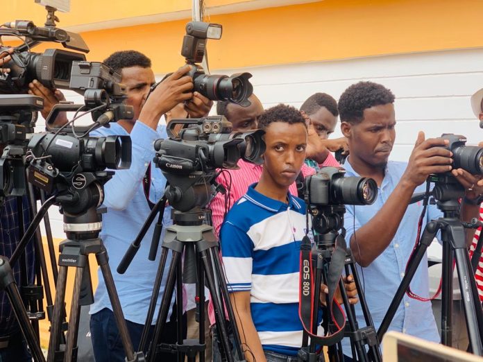 Somali journalists gather to cover a press conference during the trial of journalist Abdiaziz Gurbiye at Banadir Regional Court on 7 July, 2020.