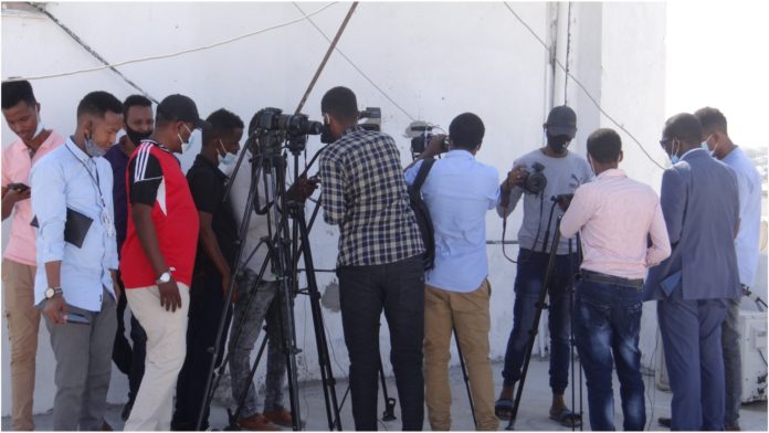 Journalists cover a press conference by SJS secretary general in Mogadishu on Monday 22 March, 2021. | PHOTO by Mohamed Jibril for SJS.