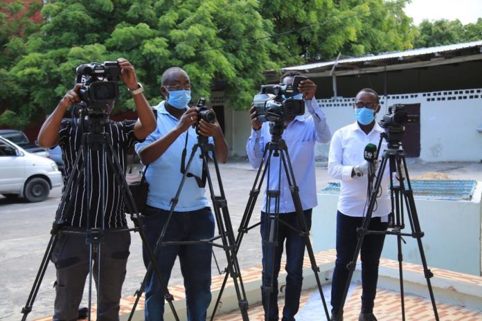 Journalists gather to cover a public event in Mogadishu in March 2021.