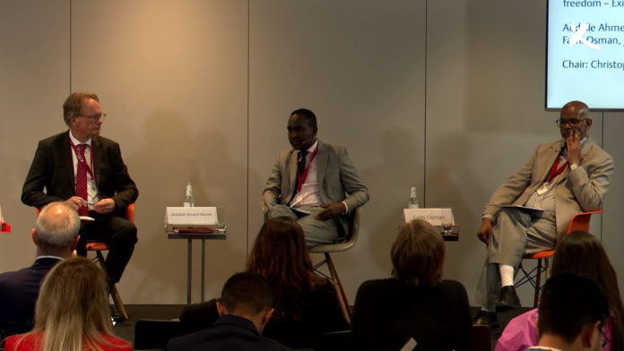 SJS Secretary-General, Abdalle Mumin (centre) speaks during a panel discussion during Exile Media Forum in Hamburg, Germany on 16 May, 2022. | PHOTO/COURTESY.