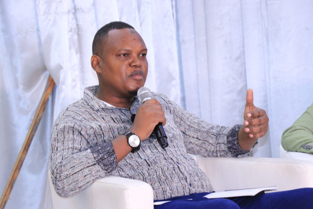 Prof. Hassan Ismail Abdi speaks during a panel discussion on human rights held in Mogadishu, Somalia on 10 December, 2023. |Photo/SJS.