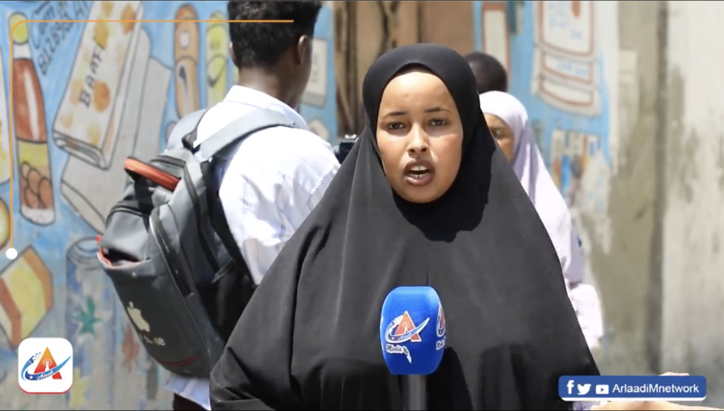 All journalists and media crew were subsequently forced to leave the scene affecting their reporting. This photo shows journalist Amina Ibrahim of Arlaadi Media Network reporting near the cemetery on Tuesday 11 June, 2024. | PHOTO/ Arlaadi Media Network.